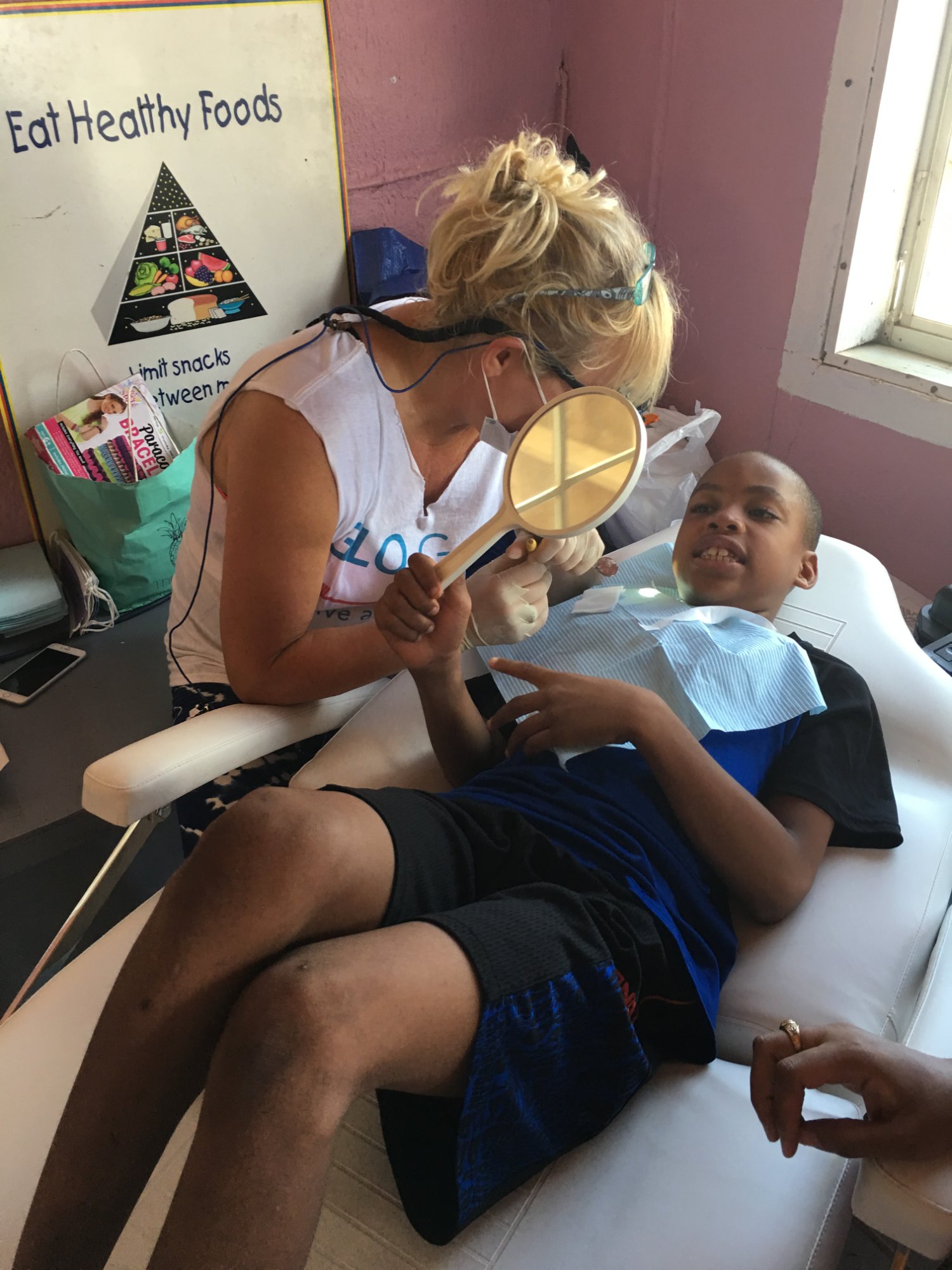 Showing a young patient his new smile